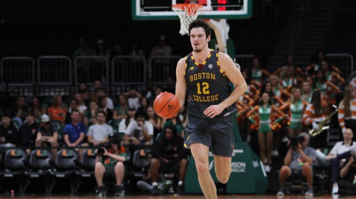 Boston College Eagles forward Quinten Post (12) dribbles the basketball against the Miami Hurricanes during the first half at Watsco Center.